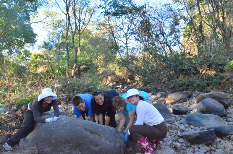 Picking rocks in the river for the house foundation... having some fun doing it